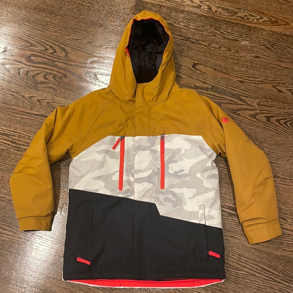 686 Kids Ski Snowboard Jacket in Mustard and Black with Camo